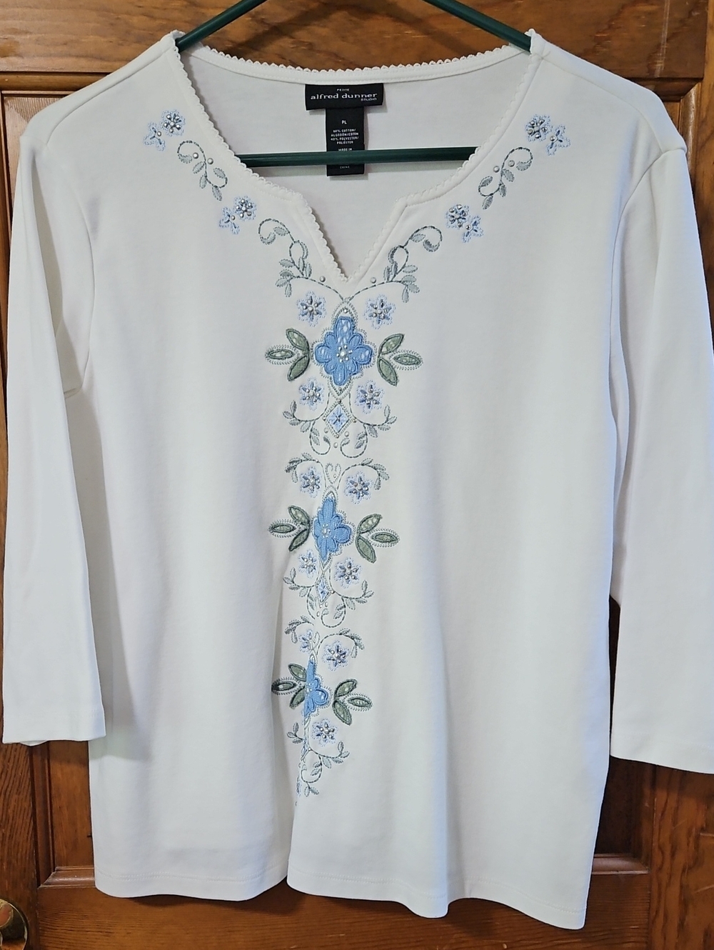 Alfred Dunner cream long-sleeve top with blue floral embroidery